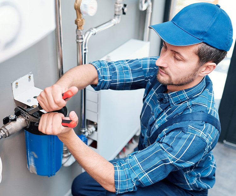Person installing water filter